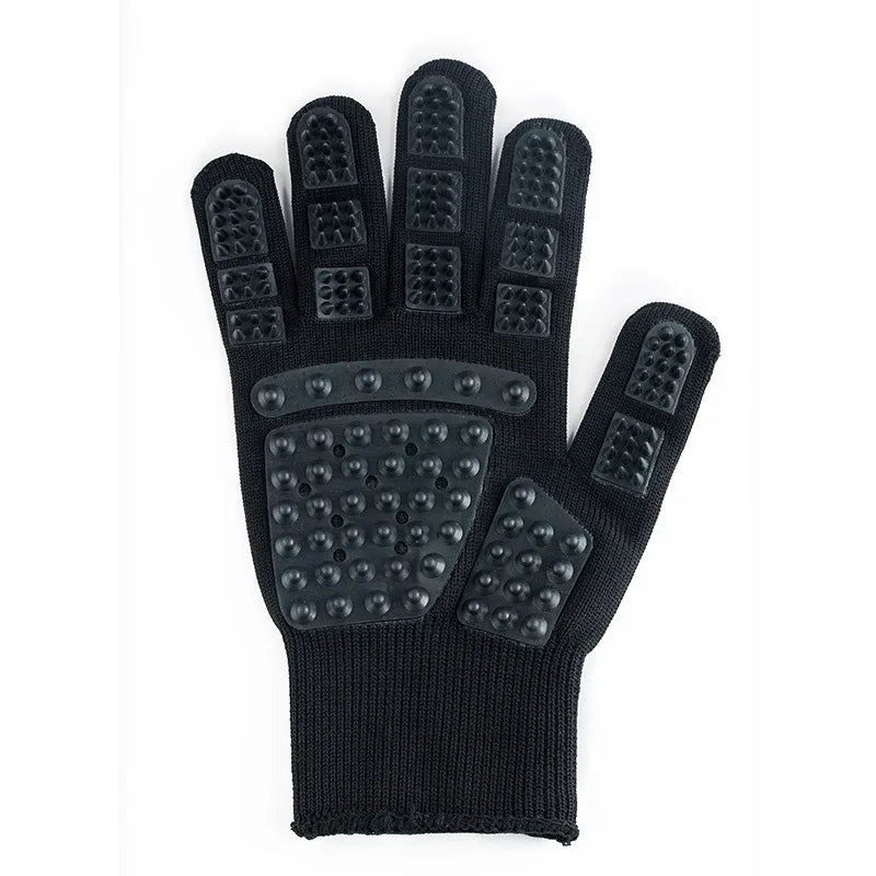 Cat grooming glove in black, left hand, isolated