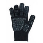 Cat grooming glove in black, left hand, isolated
