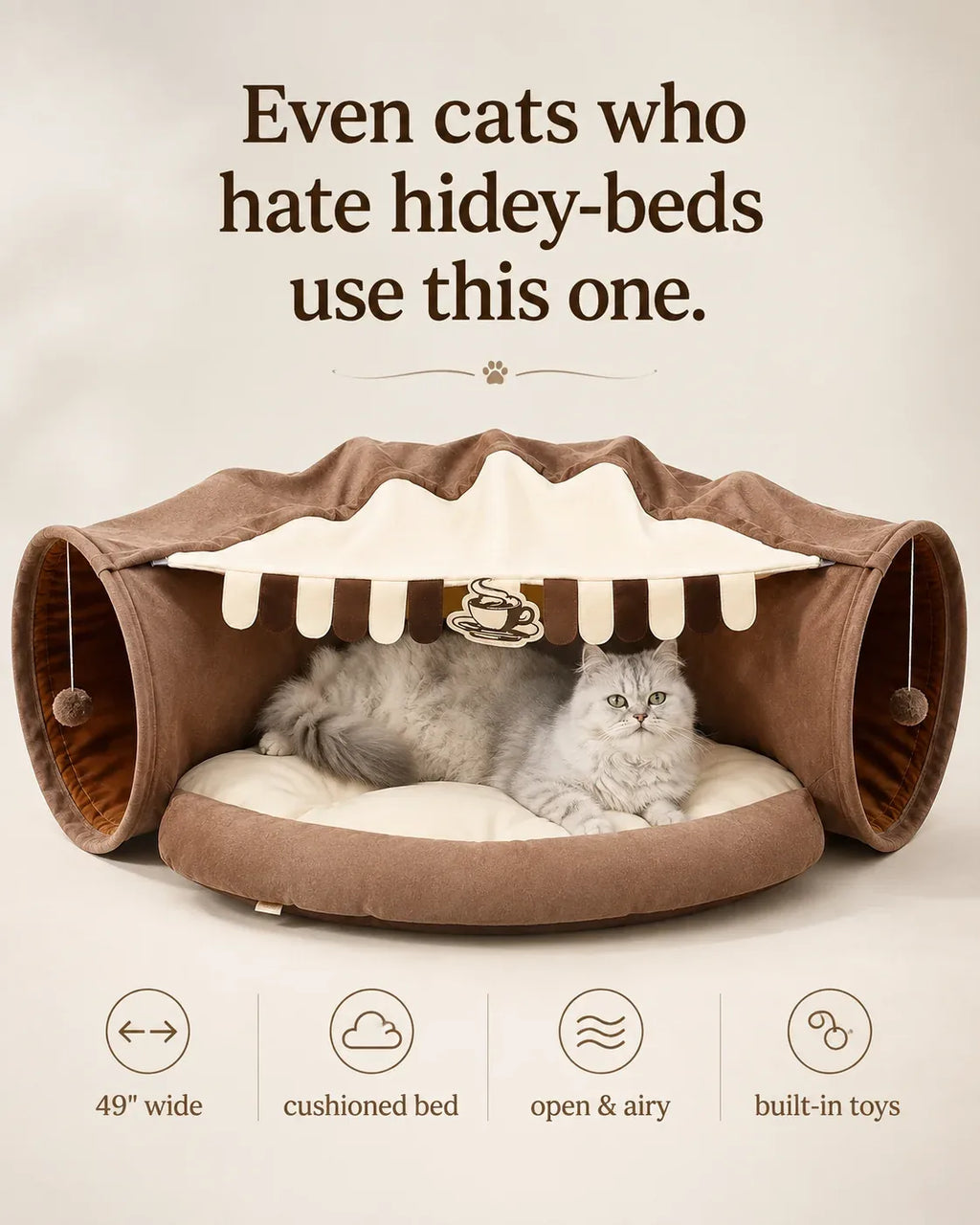 Even cats who hate hidey-beds use this one — cat on the thick cushioned bed of the mocha tunnel sofa, 49 inches wide, open and airy with built-in toys