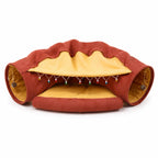 Terracotta and mustard cat tunnel sofa bed with bead garland, studio white background