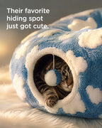 Their favorite hiding spot just got cute — cat peeking from the cloud tunnel with the pom-pom