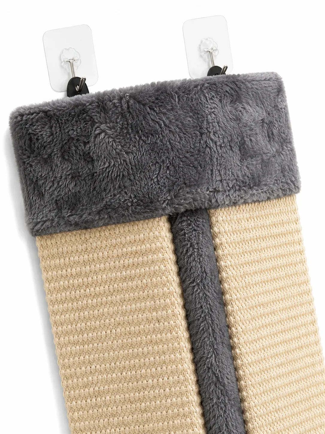 Close-up of the two adhesive hooks that hang the corner scratcher without drilling