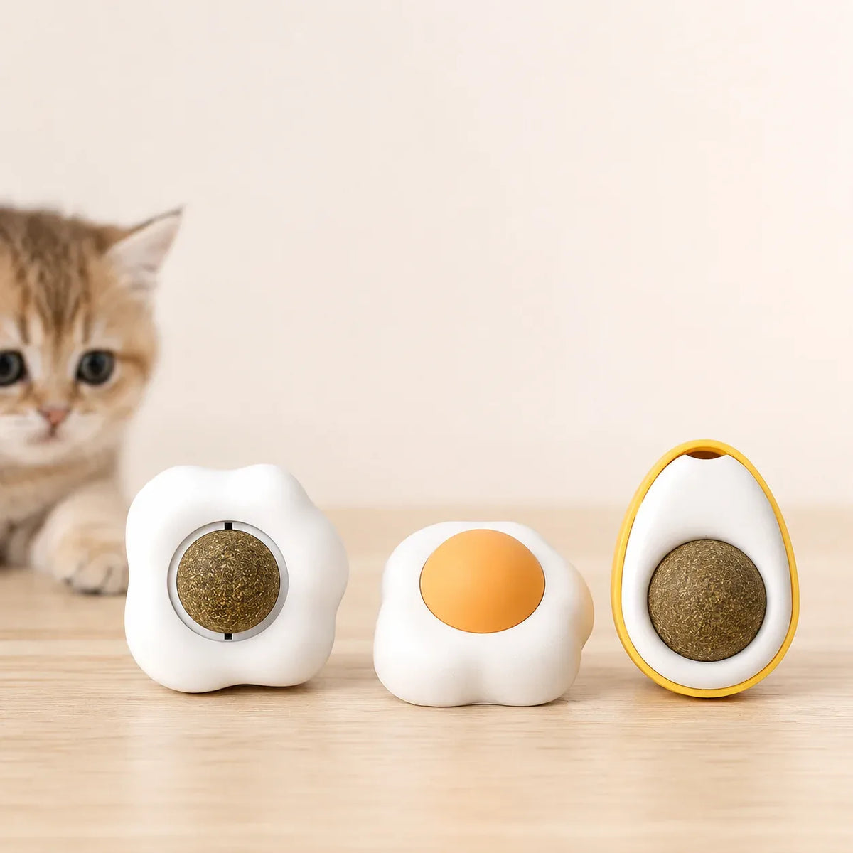 Both egg styles of the silvervine catnip wall ball on a table