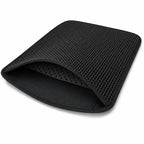Flexible black double-layer litter mat folded to show both layers