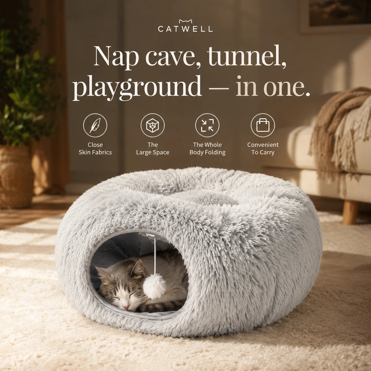 Nap cave, tunnel and playground in one — cat sleeping inside the grey plush donut bed