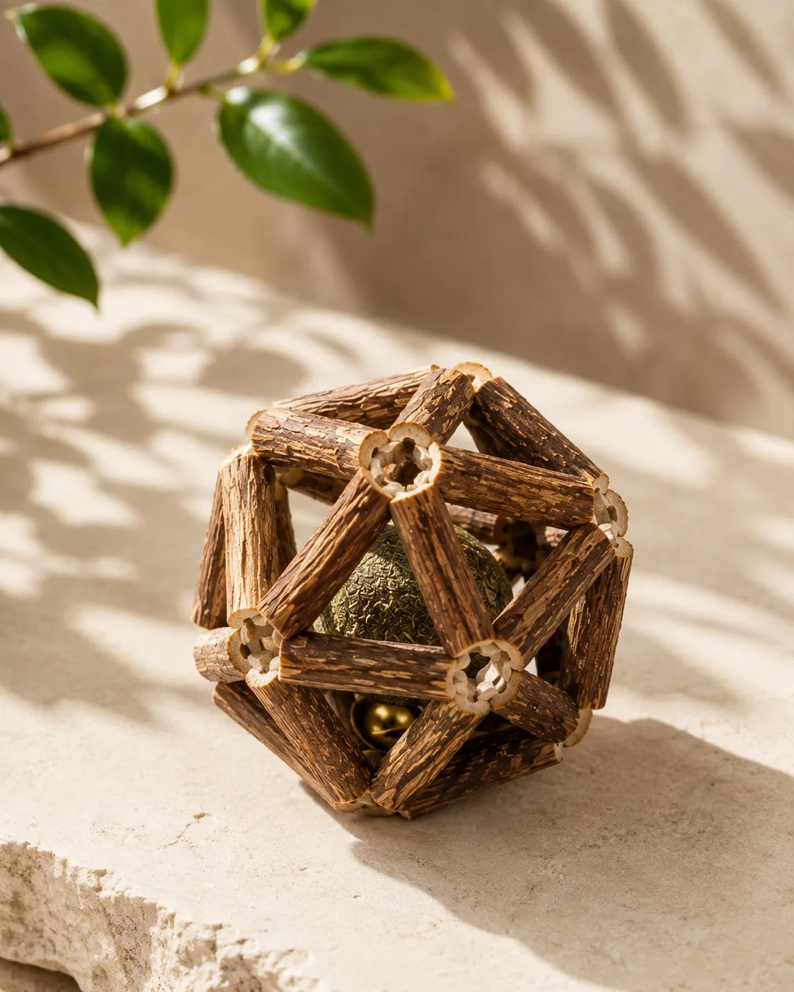 Hand-woven XL silvervine stick ball with catnip core on a stone
