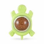 Wall-mounted silvervine catnip ball in green turtle holder, isolated