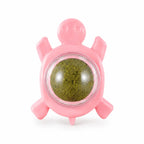 Wall-mounted silvervine catnip ball in pink turtle holder, isolated
