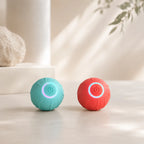 Blue and red smart rolling cat balls side by side with LED rings