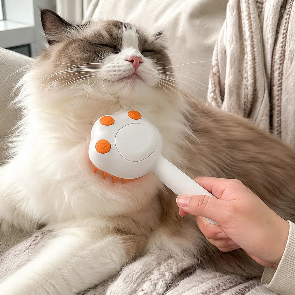 Ragdoll cat enjoying a chin massage with the white steam brush