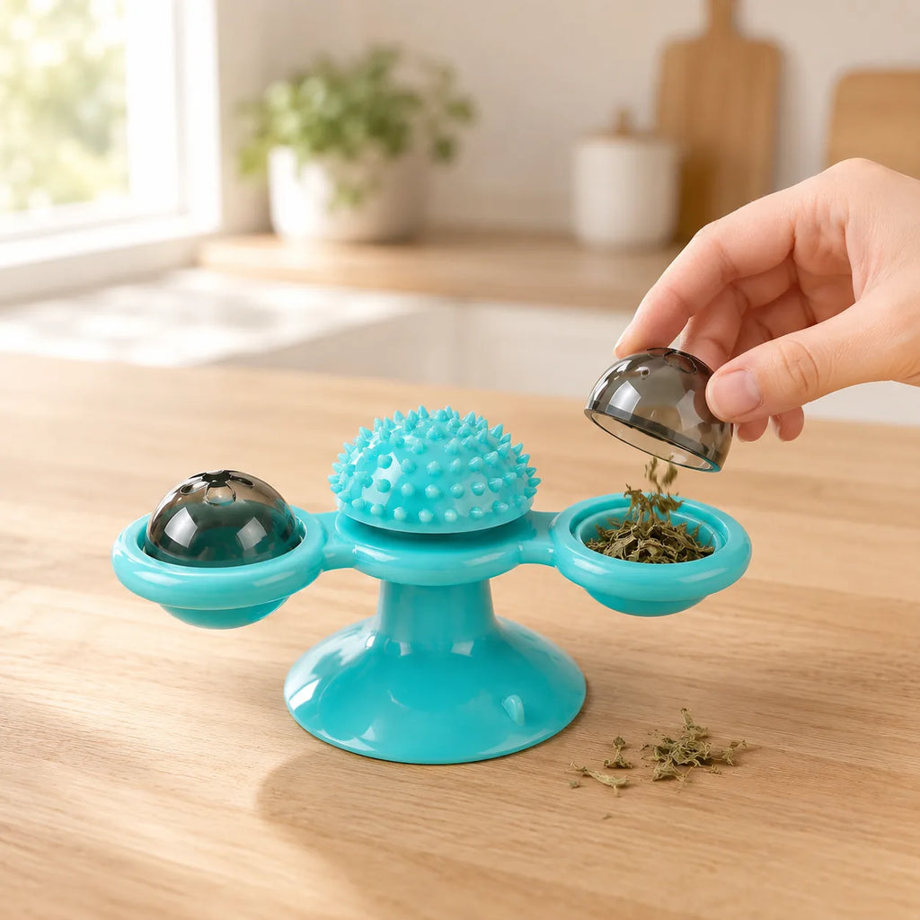 Hand refilling the windmill cat toy's clear compartment with catnip